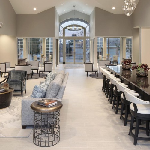Take advantage of all Carriage Place has to offer a large kitchen with a bar and chairs
