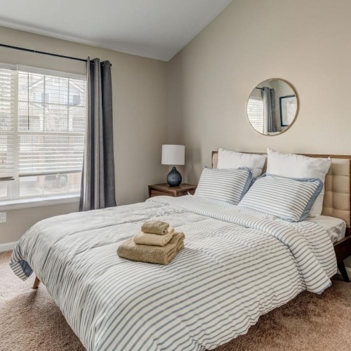 Bedroom options to fit every lifestyle a bedroom with a bed and a mirror